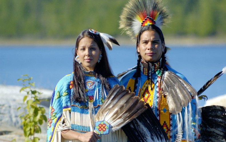 Man and woman in traditional Canadian Anishinaabe garb