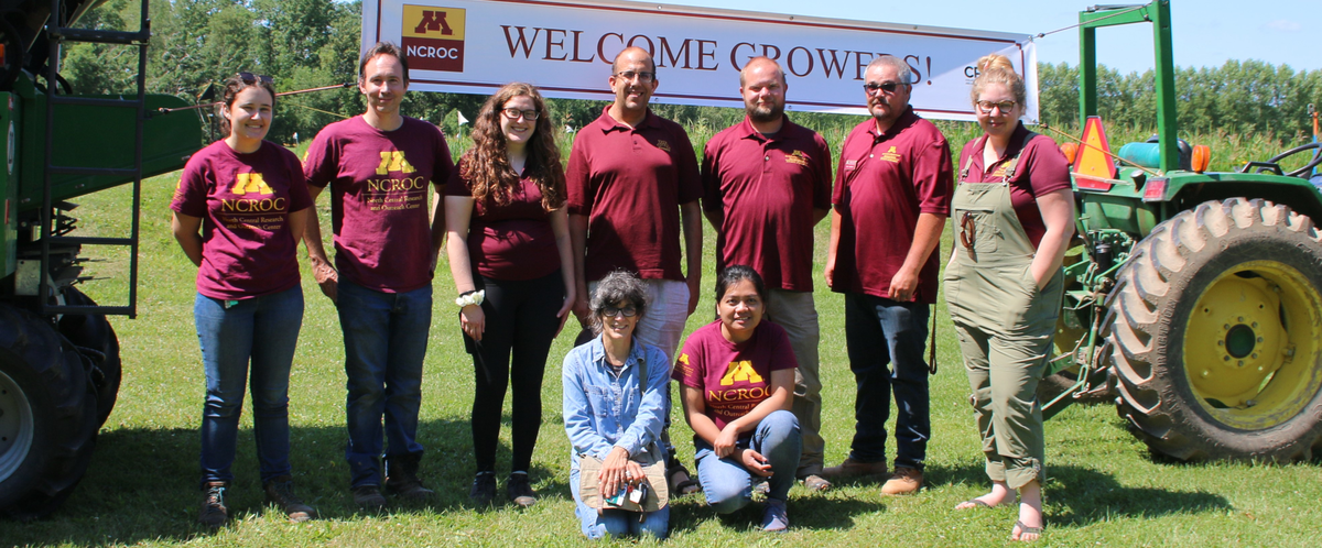 Program members in front of a welcome growers banner.